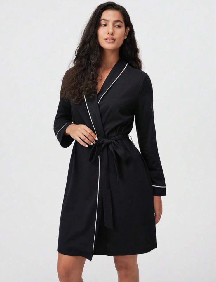 La docette black robe with white piping, front view